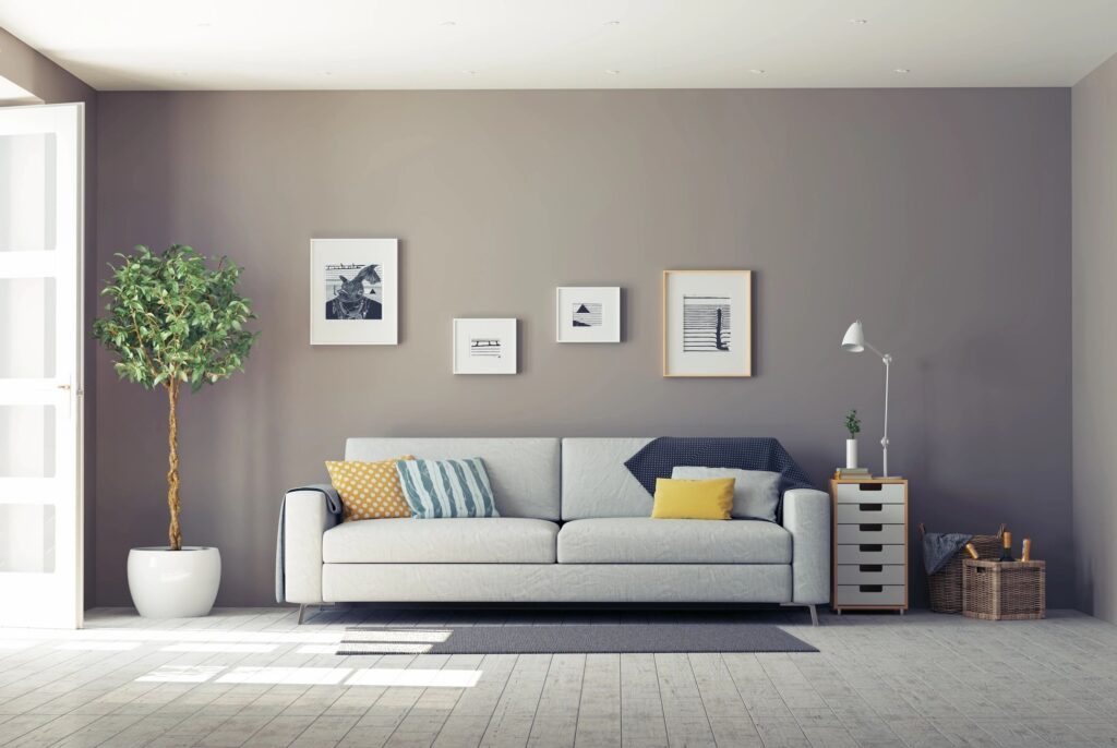 minimalist design sofa with pictures walled on grey wall